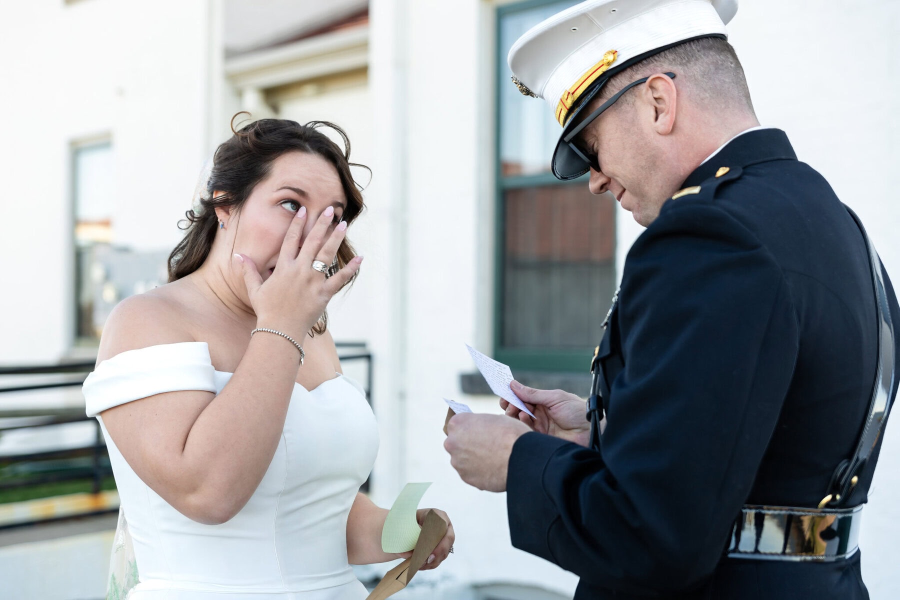 Wedding at the Newport Naval Station Officers' Club 18 A bride wipes away tears as a uniformed officer reads heartfelt vows at their Newport Naval Station wedding.