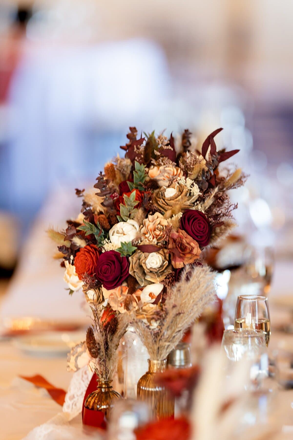 Wedding at the Newport Naval Station Officers' Club 63 A bouquet of dried flowers in red, cream, and brown graces a banquet table at a Newport Naval Station Officers' Club wedding.