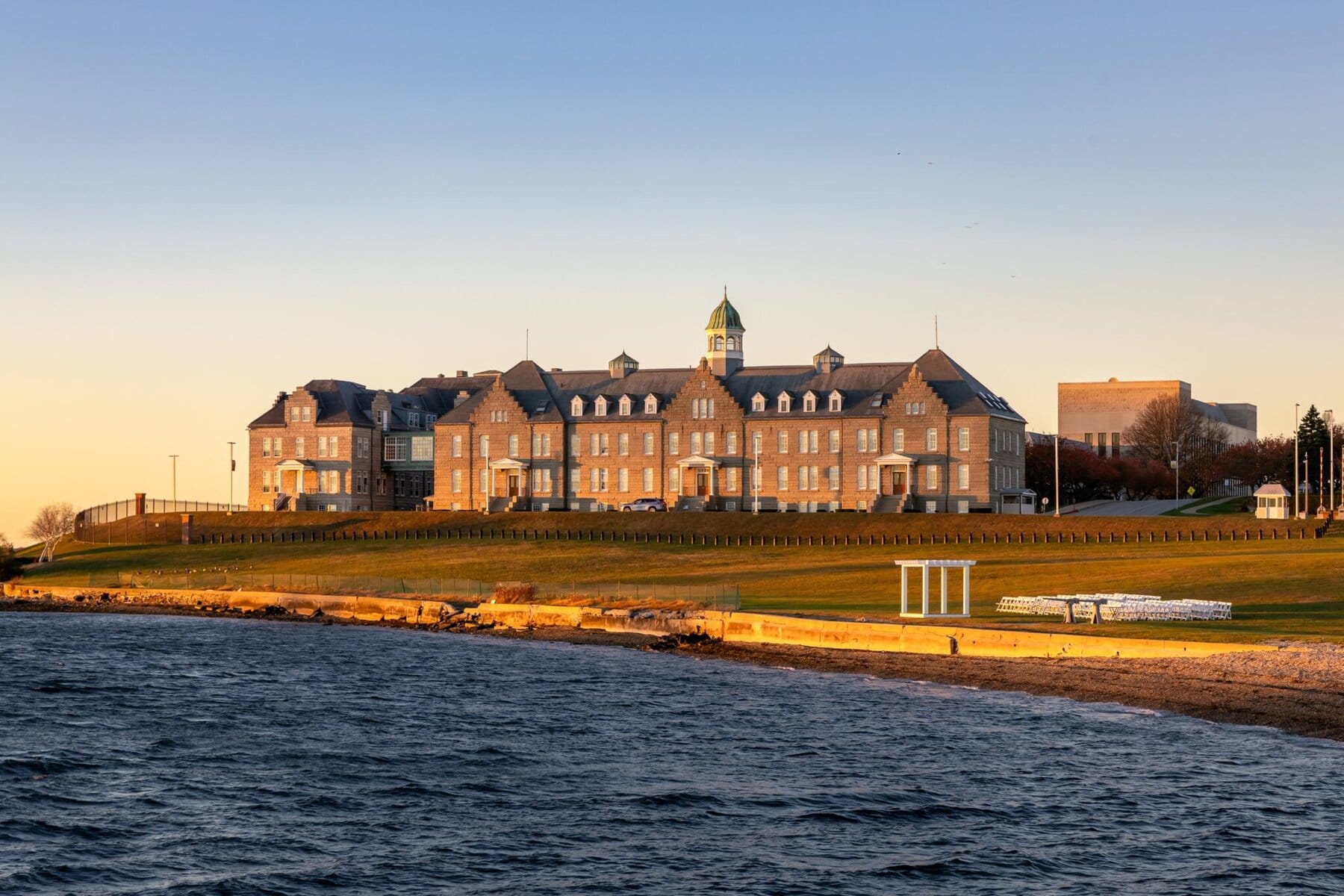 Wedding at the Newport Naval Station Officers' Club 77 A large building with a tower on the side, located at the Newport Naval Station, ideal for a wedding or special event.