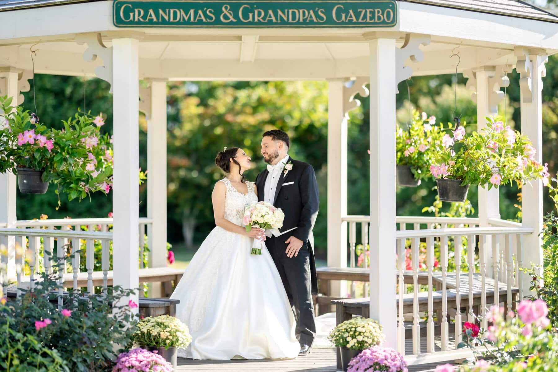 Wedding Photos at Roseland Nursery 8 A bride and groom pose in "Grandma's & Grandpa's Gazebo" at Roseland Nursery, perfect for cherished wedding photography.