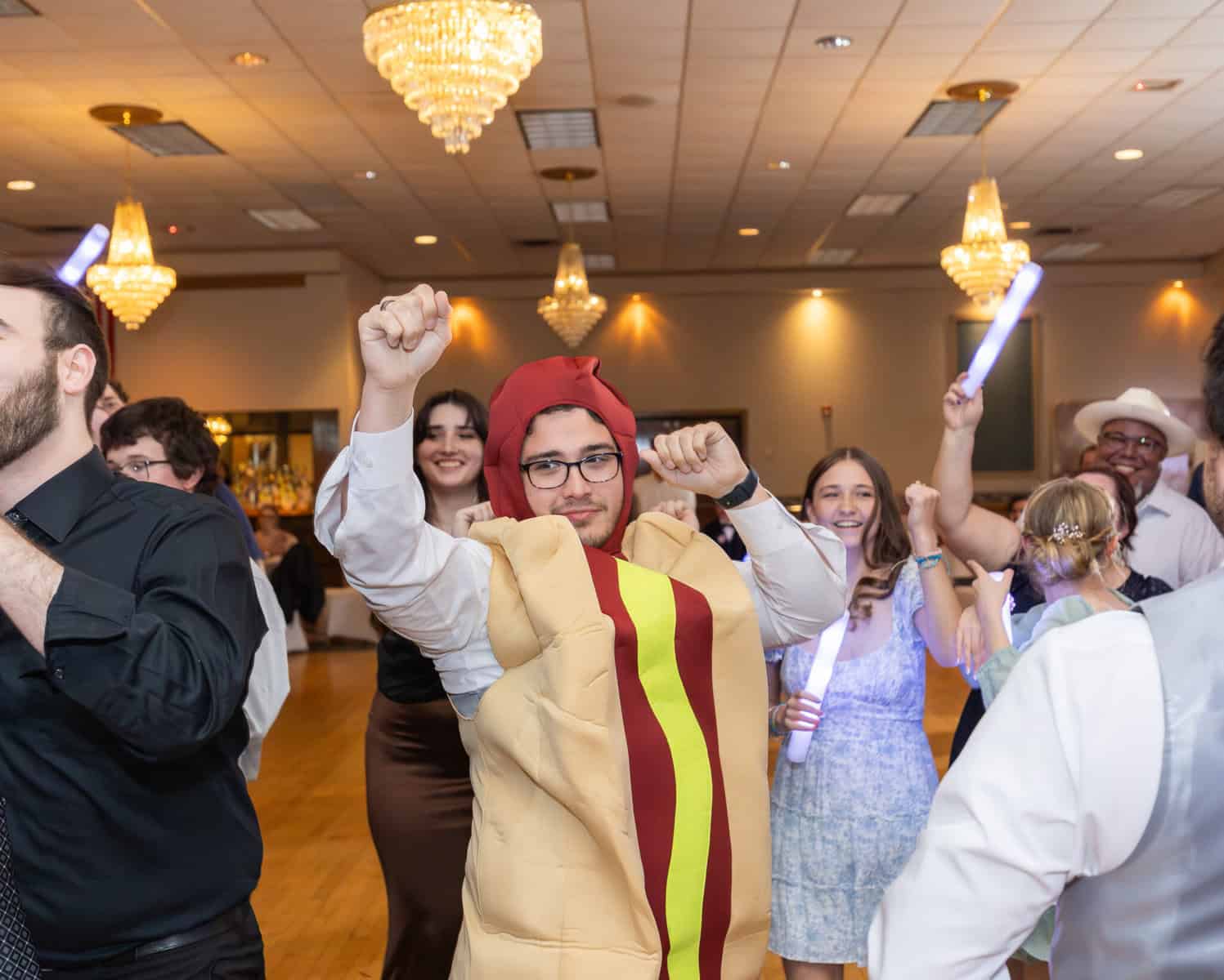Wedding at the Springfield Elks lodge 83 A man in garment at an elks lodge with people in the background.